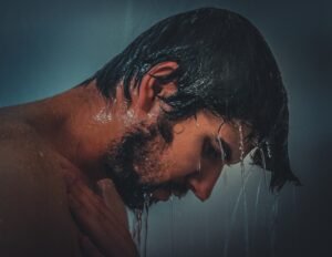 man taking cold shower